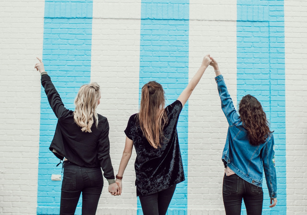 Three friends together, celebrating time together without the stress of a toxic relationship.